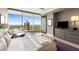 Bright bedroom with floor-to-ceiling windows, hardwood floors, sitting area, and stylish decor at 3630 Peachtree Ne Rd # 3207, Atlanta, GA 30326