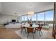 Elegant dining room with a modern chandelier and expansive city view windows at 3630 Peachtree Ne Rd # 3207, Atlanta, GA 30326