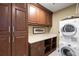 Organized laundry room with ample storage space, modern washer and dryer, and countertop area at 3630 Peachtree Ne Rd # 3207, Atlanta, GA 30326