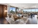Bright living room featuring comfortable seating, a stylish rug, and panoramic skyline views at 3630 Peachtree Ne Rd # 3207, Atlanta, GA 30326