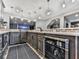 Finished basement wet bar with mini-fridge, undermount sink, and modern cabinetry at 716 Crimson Morning Vw, Canton, GA 30114