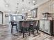 Finished basement wet bar with seating, brick accent wall, cabinets and room for entertainment at 716 Crimson Morning Vw, Canton, GA 30114
