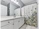 Clean bathroom with white vanity, floral shower curtain, and neutral paint at 716 Crimson Morning Vw, Canton, GA 30114