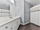 Clean bathroom with tile floor, white vanity, and shower with curtain at 716 Crimson Morning Vw, Canton, GA 30114
