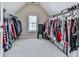Walk-in closet with hanging racks, shelving, and a window at 716 Crimson Morning Vw, Canton, GA 30114