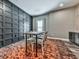 Finished basement dining area with modern decor, accent wall, and hardwood floors at 716 Crimson Morning Vw, Canton, GA 30114