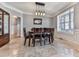 Bright dining room with classic wainscoting and a large window at 716 Crimson Morning Vw, Canton, GA 30114