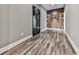 Hallway with wood floors, gray walls, barrel mural, and Browning gun safe at 716 Crimson Morning Vw, Canton, GA 30114