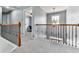 The upstairs hallway has carpet and a view into a bedroom at 716 Crimson Morning Vw, Canton, GA 30114