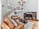 Spacious living room features hardwood floors, comfortable seating, and a staircase to the upper level at 716 Crimson Morning Vw, Canton, GA 30114
