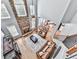 Aerial view of the living room with fireplace, high ceilings, and open-concept kitchen at 716 Crimson Morning Vw, Canton, GA 30114