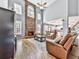 Spacious living room with a stone fireplace, ceiling fan, and comfortable seating at 716 Crimson Morning Vw, Canton, GA 30114