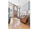 Bright living room features a stone fireplace, hardwood floors, tall windows, and high ceilings at 716 Crimson Morning Vw, Canton, GA 30114