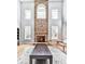This living room features a floor-to-ceiling stone fireplace, large windows, and hardwood floors at 716 Crimson Morning Vw, Canton, GA 30114