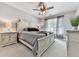 Bedroom with ceiling fan, bedside tables, and large window at 716 Crimson Morning Vw, Canton, GA 30114