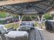 Outdoor seating area with wicker furniture, string lights, ceiling fan, and barbecue grill at 716 Crimson Morning Vw, Canton, GA 30114
