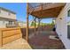 A backyard with a small patch of grass and a covered patio at 815 Regal Sw Ln, Atlanta, GA 30331