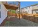 A backyard with a small patch of grass and a covered patio at 815 Regal Sw Ln, Atlanta, GA 30331