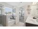 Bright bathroom features double vanity, soaking tub, and separate shower at 815 Regal Sw Ln, Atlanta, GA 30331