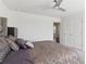 Bedroom featuring a comfortable bed, neutral tones, and modern ceiling fan at 815 Regal Sw Ln, Atlanta, GA 30331