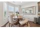 Dining area featuring a round table, stylish chairs, and decorative mirror at 815 Regal Sw Ln, Atlanta, GA 30331