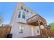 Back exterior featuring a small yard, covered patio, and multiple windows for natural light at 815 Regal Sw Ln, Atlanta, GA 30331