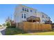 Back exterior featuring a small yard, covered patio, and multiple windows for natural light at 815 Regal Sw Ln, Atlanta, GA 30331