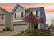 Charming two-story home with a two-car garage, enhanced by a beautiful tree and landscaped front yard at 815 Regal Sw Ln, Atlanta, GA 30331