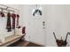 Welcoming foyer featuring a bench, coat rack, and decorative accents by the door at 815 Regal Sw Ln, Atlanta, GA 30331