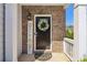 Close-up of a front door, decorative wreath, and 'Welcome' sign adding charm at 815 Regal Sw Ln, Atlanta, GA 30331