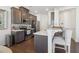 Well-equipped kitchen featuring modern appliances, counter seating, and stylish backsplash at 815 Regal Sw Ln, Atlanta, GA 30331