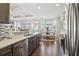 View of open-concept kitchen featuring stainless steel appliances and dining area at 815 Regal Sw Ln, Atlanta, GA 30331
