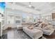 Open-concept living area with large sectional, fireplace, and view of dining area at 815 Regal Sw Ln, Atlanta, GA 30331