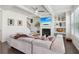 Cozy living room with coffered ceiling, fireplace, and built-in shelving at 815 Regal Sw Ln, Atlanta, GA 30331