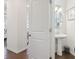 Bright powder room with pedestal sink, modern fixtures and decor at 815 Regal Sw Ln, Atlanta, GA 30331