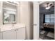 Bathroom view into bedroom with double sink vanity, and framed mirrors at 1137 Liberty Nw Pkwy, Atlanta, GA 30318