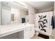 Bathroom featuring shower with decorative curtain, wide vanity with double sink, and modern fixtures at 1137 Liberty Nw Pkwy, Atlanta, GA 30318