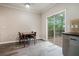 Bright dining area with sliding doors opening to the outside deck and a view of the trees at 1137 Liberty Nw Pkwy, Atlanta, GA 30318