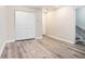 Empty room with vinyl floors, white bi-fold closet and hallway doors at 1137 Liberty Nw Pkwy, Atlanta, GA 30318