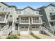 Charming townhome with dual front-facing garages, second-story balconies, and inviting curb appeal at 1137 Liberty Nw Pkwy, Atlanta, GA 30318