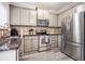 Modern kitchen featuring stainless steel appliances, granite countertops, and ample cabinet space at 1137 Liberty Nw Pkwy, Atlanta, GA 30318
