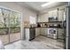 Well-equipped kitchen featuring stainless steel appliances, granite countertops, and access to the deck at 1137 Liberty Nw Pkwy, Atlanta, GA 30318