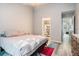 Comfortable bedroom with neutral colors, a ceiling fan, and ensuite bath at 1137 Liberty Nw Pkwy, Atlanta, GA 30318