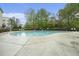 Sparkling community pool surrounded by trees and lounge chairs, offering a refreshing escape at 1137 Liberty Nw Pkwy, Atlanta, GA 30318