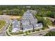 Aerial view of beautiful townhomes surrounded by lush trees and landscaping in a suburban neighborhood at 2004 Cortland Rd, Milton, GA 30009