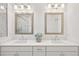 Stylish bathroom with double sinks, modern fixtures, framed mirrors, and pristine white cabinetry at 2004 Cortland Rd, Milton, GA 30009