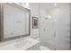 Bright bathroom with a glass shower, modern fixtures, and a large mirror at 2004 Cortland Rd, Milton, GA 30009