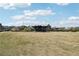 Open field in a community area with an outdoor gathering space surrounded by mature trees at 2004 Cortland Rd, Milton, GA 30009