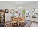 Dining room with wood table, chandelier, cabinet, and windows that provide natural light at 2004 Cortland Rd, Milton, GA 30009