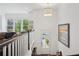 Inviting entryway with staircase and a view of the living area, enhanced by a stylish pendant light at 2004 Cortland Rd, Milton, GA 30009